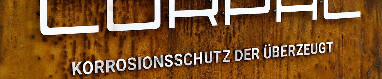 Logo Corpac mit Rostschild